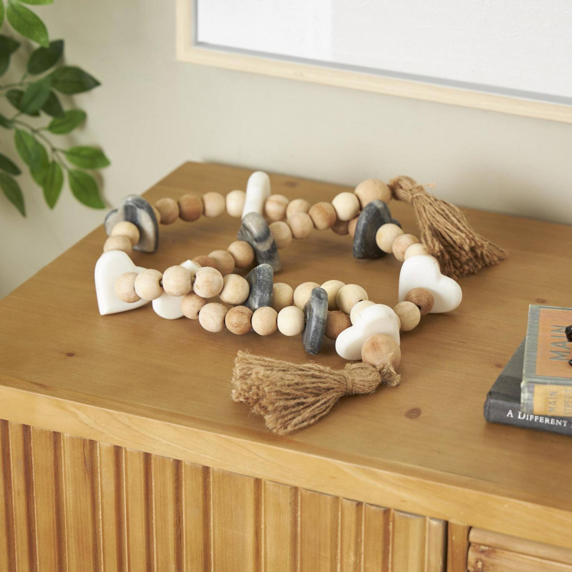 5ft. Light Brown Wood & Marble Heart Garland with Tassel